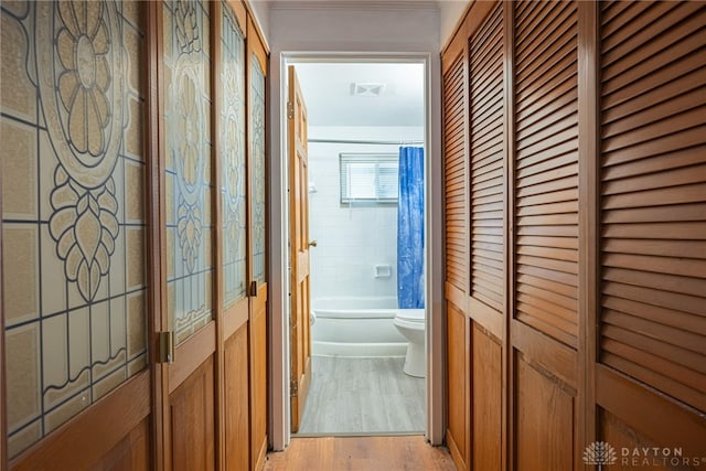 corridor featuring light wood-type flooring