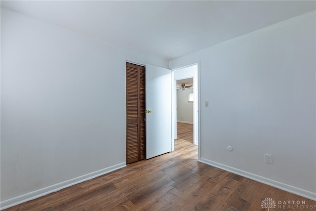 unfurnished room featuring dark hardwood / wood-style floors