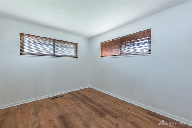 spare room featuring hardwood / wood-style flooring