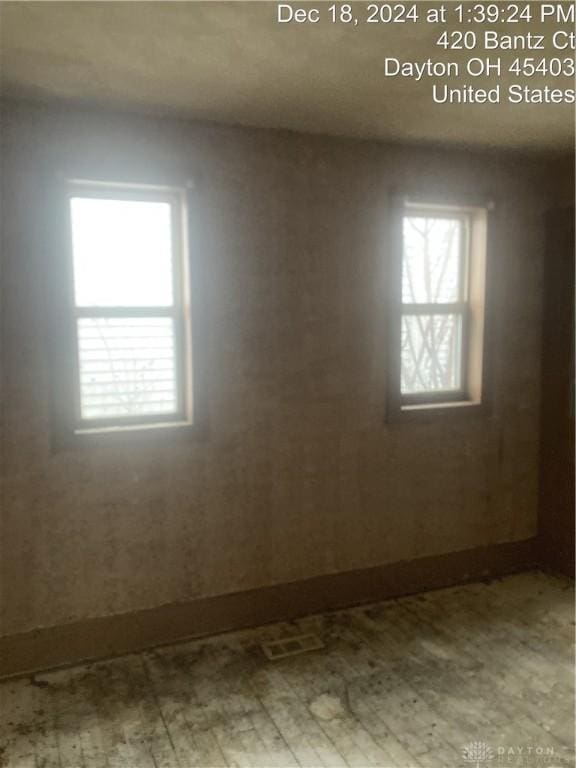 empty room featuring hardwood / wood-style flooring