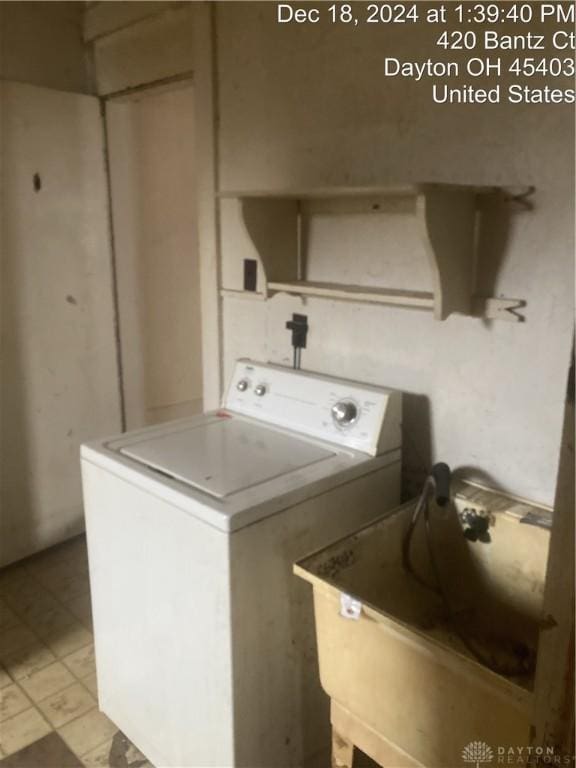 laundry area with sink and washer / dryer