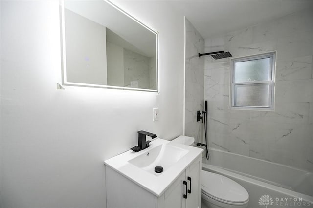 full bathroom with vanity, toilet, and tiled shower / bath combo