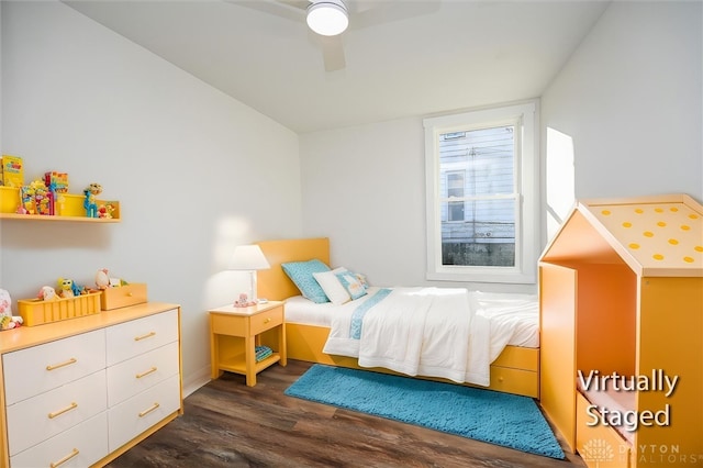 bedroom with ceiling fan and dark wood-type flooring