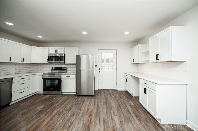 kitchen featuring white cabinets, dark hardwood / wood-style floors, and appliances with stainless steel finishes