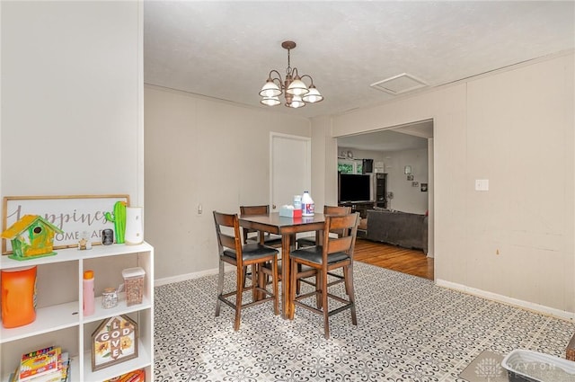 dining space featuring an inviting chandelier