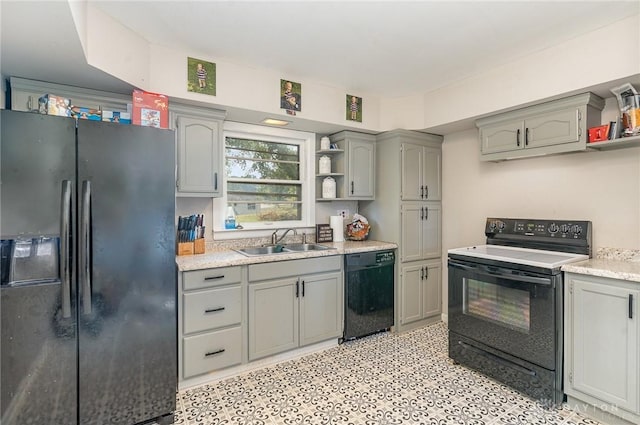 kitchen with gray cabinetry, sink, and black appliances