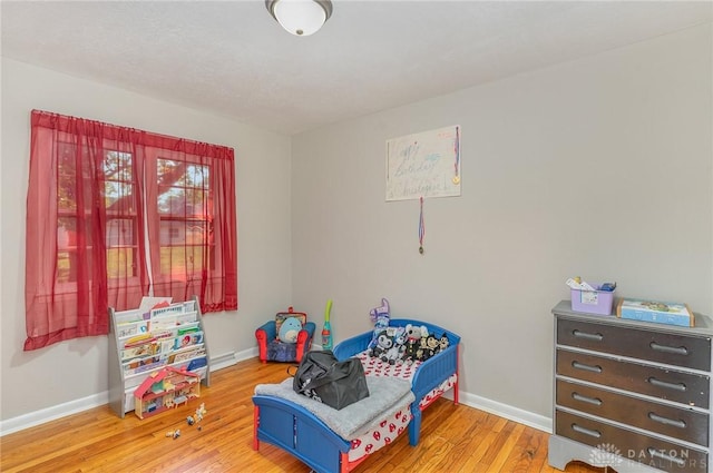 playroom with hardwood / wood-style floors