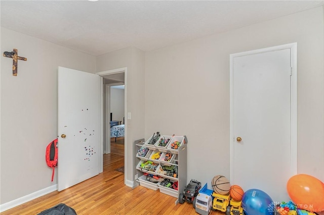 game room featuring light hardwood / wood-style floors