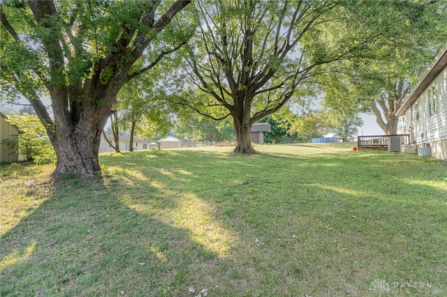 view of yard featuring a wooden deck