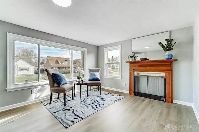 living area with hardwood / wood-style flooring