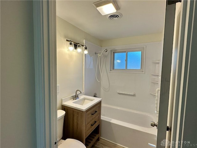 full bathroom featuring vanity, shower / bath combination, toilet, and hardwood / wood-style flooring