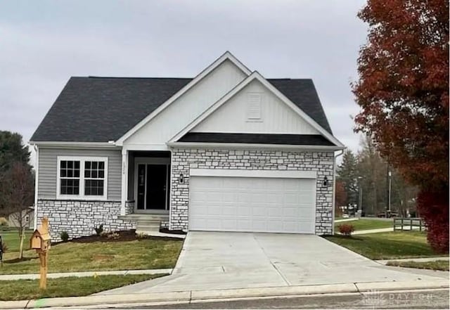 view of front of house featuring a front yard and a garage