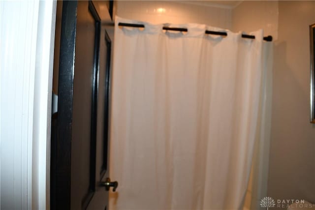 bathroom with curtained shower