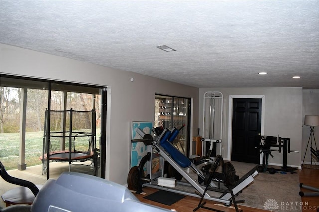 exercise area with a textured ceiling