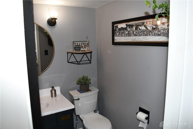 bathroom featuring vanity and toilet