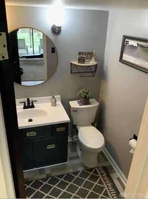 bathroom with tile patterned flooring, vanity, and toilet