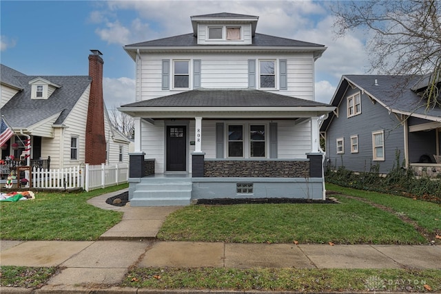 view of front of house featuring covered porch and a front yard