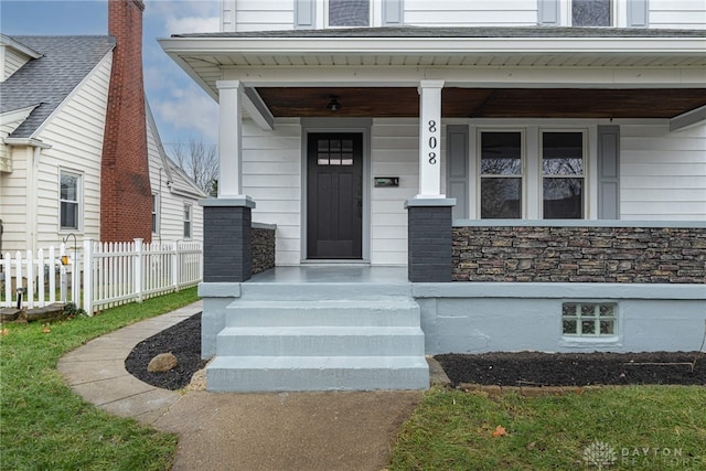 property entrance with covered porch