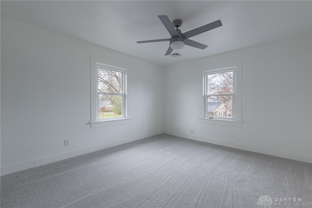 spare room with carpet and ceiling fan