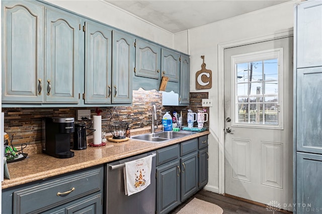 kitchen with dishwasher, backsplash, hardwood / wood-style flooring, and sink