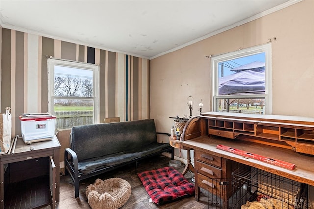 sitting room with crown molding and hardwood / wood-style flooring