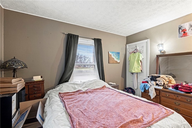 bedroom featuring a textured ceiling