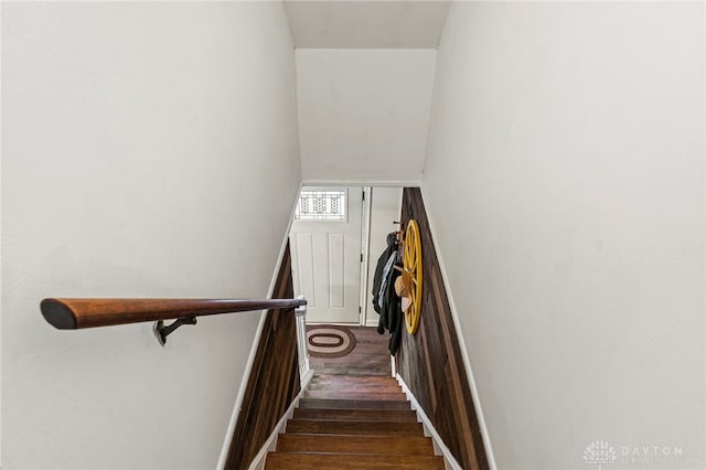 staircase featuring wood-type flooring