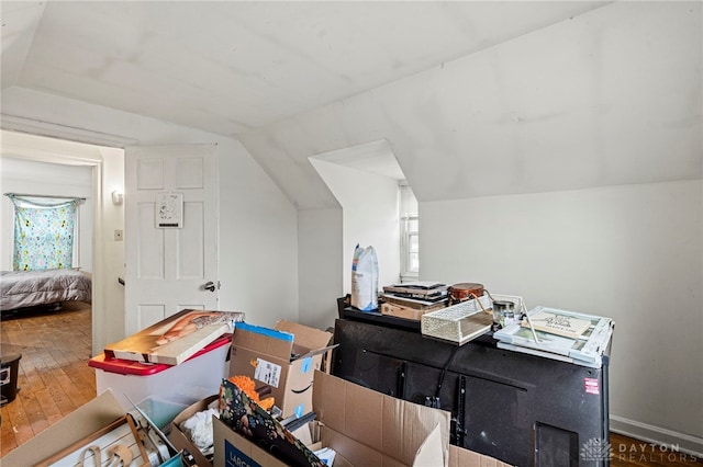 bonus room featuring a wealth of natural light, hardwood / wood-style floors, and vaulted ceiling