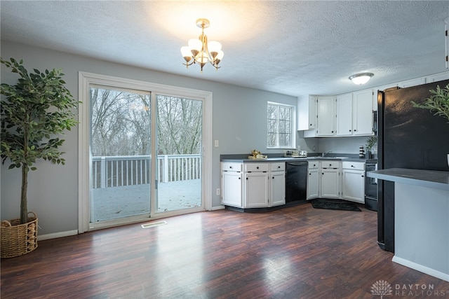 kitchen featuring an inviting chandelier, white cabinets, black dishwasher, decorative light fixtures, and dark hardwood / wood-style flooring