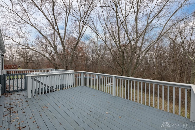 wooden deck featuring a water view