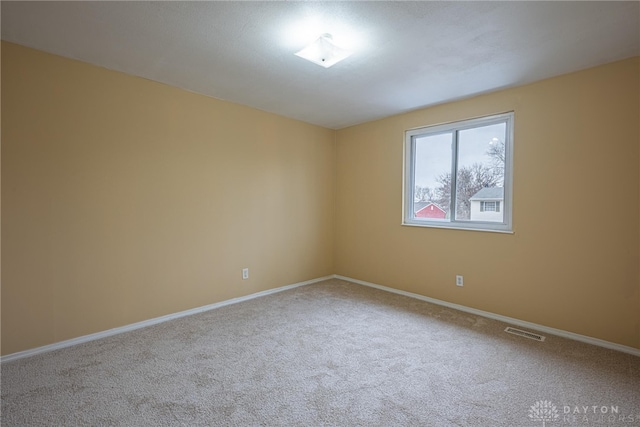 unfurnished room with carpet flooring