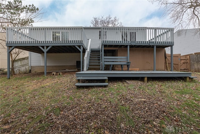 rear view of property with a wooden deck