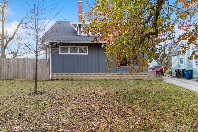 view of home's exterior with a lawn