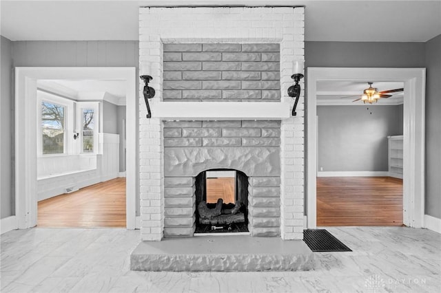 living room featuring ceiling fan, light wood-type flooring, and a brick fireplace