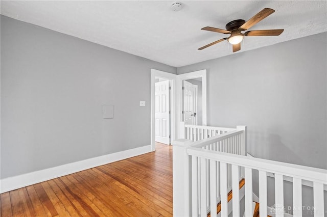 corridor featuring hardwood / wood-style floors