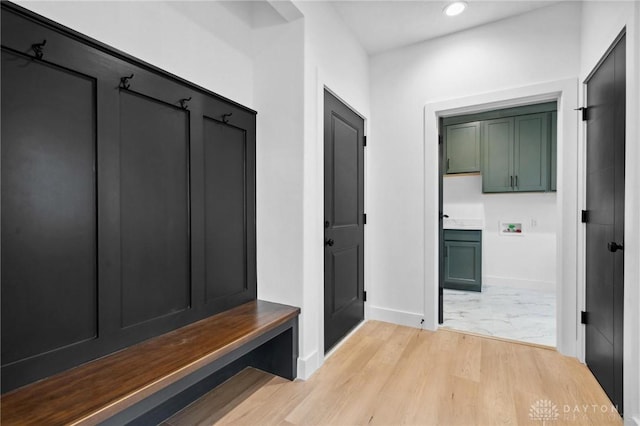 mudroom featuring recessed lighting, baseboards, and light wood finished floors