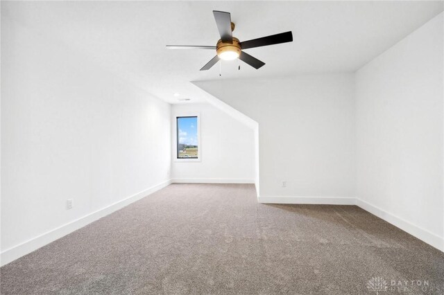 bonus room with baseboards, carpet, and ceiling fan