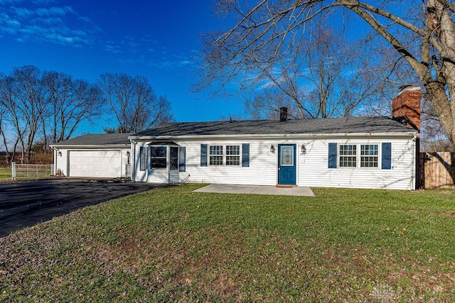 single story home featuring a front yard and a garage