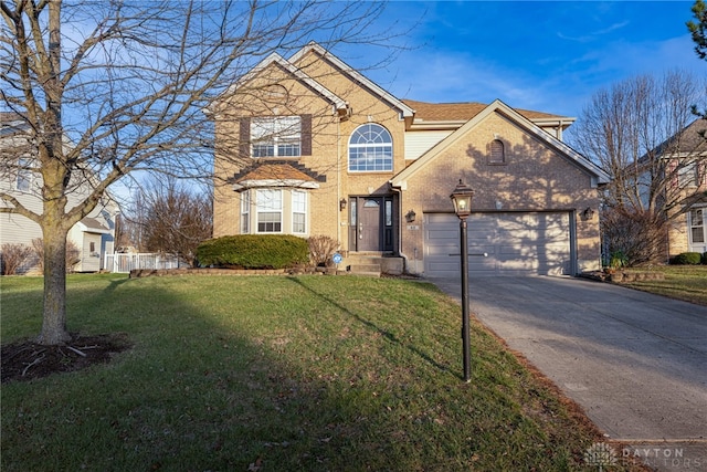 view of front property featuring a front yard and a garage