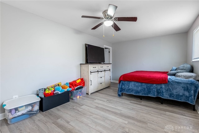 bedroom featuring ceiling fan and light hardwood / wood-style floors