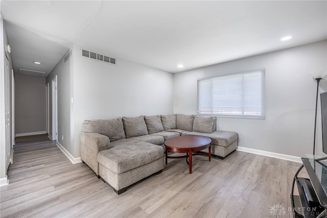 living room with light hardwood / wood-style floors