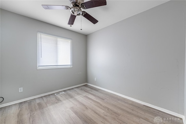 spare room with ceiling fan and light hardwood / wood-style flooring