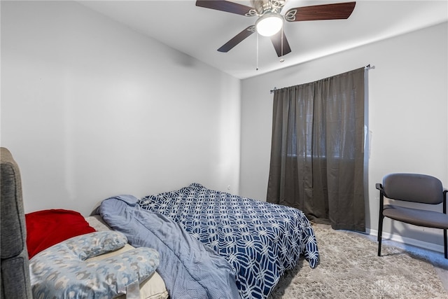 bedroom with light colored carpet and ceiling fan