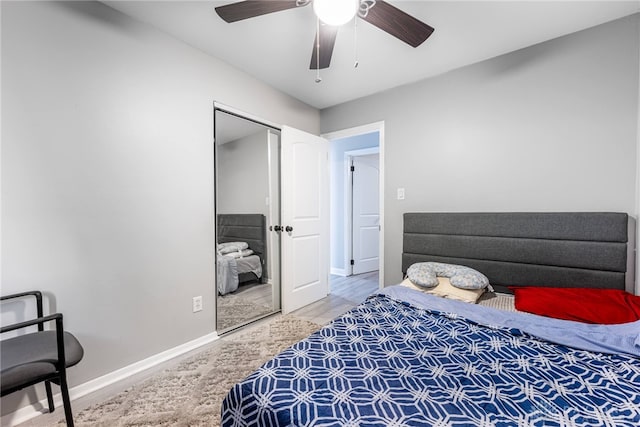 bedroom featuring ceiling fan and a closet