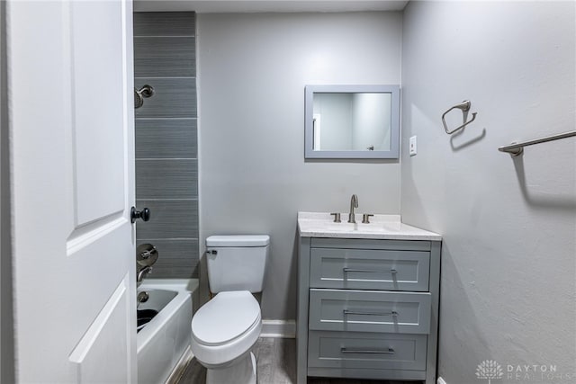 full bathroom featuring vanity, toilet, washtub / shower combination, and wood-type flooring