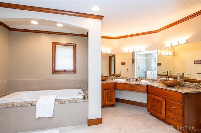 bathroom featuring plus walk in shower, vanity, tile patterned floors, and ornamental molding