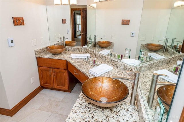 bathroom featuring tile patterned floors and vanity