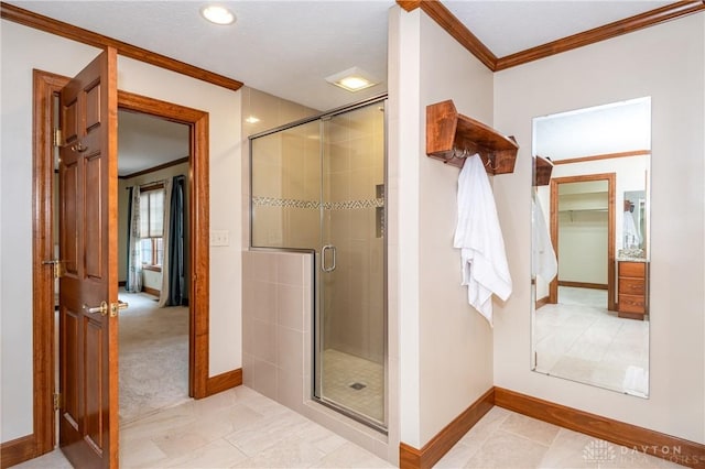 bathroom with an enclosed shower and crown molding