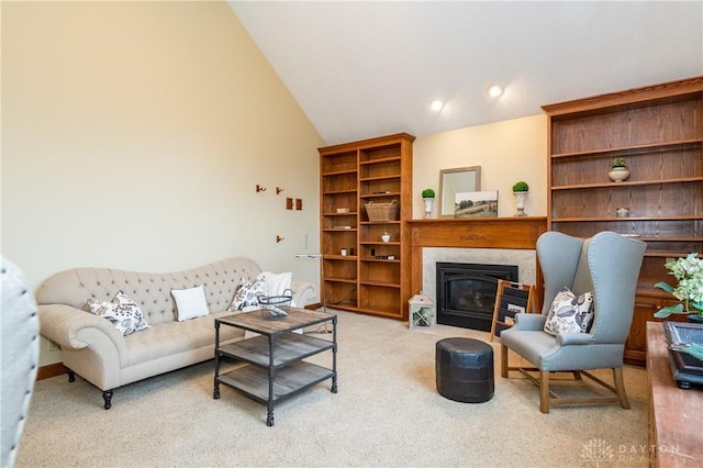 carpeted living room featuring high vaulted ceiling