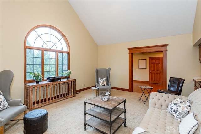 carpeted living room featuring high vaulted ceiling